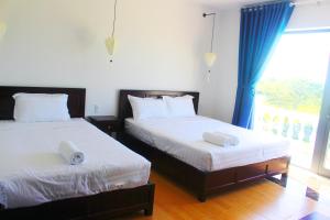 Postel nebo postele na pokoji v ubytování Hoang Y Homestay