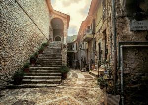 an alley with stairs in an old building at La Residenza dei Papi in Papigno
