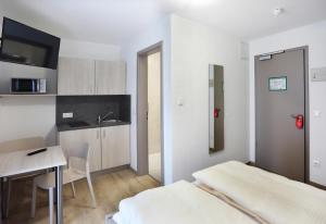 Kuchyň nebo kuchyňský kout v ubytování Apartment Hotel 37