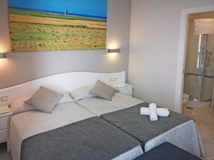 Posteľ alebo postele v izbe v ubytovaní Hostal Bodega