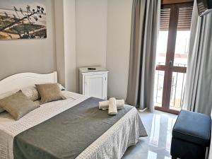 Posteľ alebo postele v izbe v ubytovaní Hostal Bodega