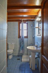 a bathroom with a sink and a toilet at Thalassini Avra in Azolimnos