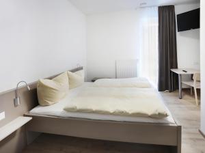 Postel nebo postele na pokoji v ubytování Apartment Hotel 37