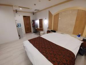 Voodi või voodid majutusasutuse Hotel Allure (Adult Only) toas