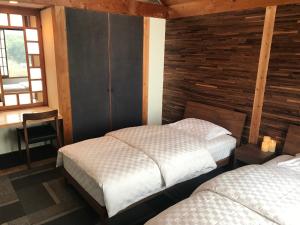 Postel nebo postele na pokoji v ubytování Shiraishi Island International Villa