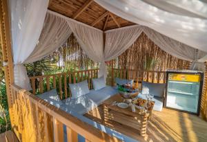 an outdoor porch with a couch and a table at Annabella Diamond Hotel - All Inclusive in Avsallar