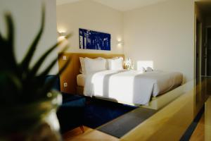 Uma cama ou camas num quarto em ó Poboa Guesthouse