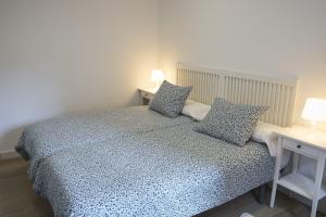 Postel nebo postele na pokoji v ubytování Foncalada 13