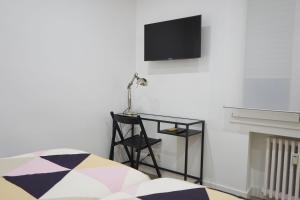 Postel nebo postele na pokoji v ubytování Foncalada 13