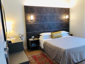 Postel nebo postele na pokoji v ubytování Hotel La Nuova Rotaia