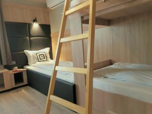 
A bunk bed or bunk beds in a room at Hotel Allur
