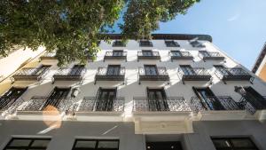 a white building with balconies on the side of it at Soho Boutique Opera in Madrid
