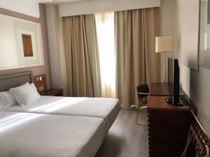 Postel nebo postele na pokoji v ubytování Hotel Olid