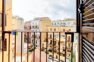 a balcony with a view of buildings at Vinylogy Apt in Rome