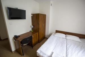 Hotel Chańcza tesisinde bir odada yatak veya yataklar