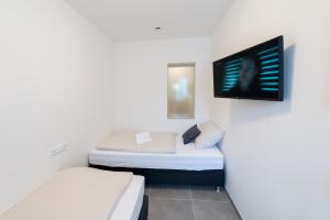 Postel nebo postele na pokoji v ubytování MOTEL24seven