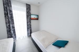Postel nebo postele na pokoji v ubytování MOTEL24seven