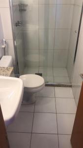 a bathroom with a shower and a toilet and a sink at Studio particular em Hotel in Salvador