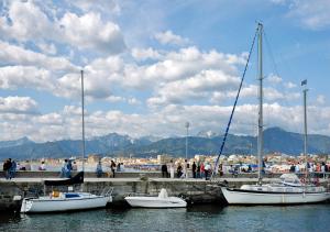 a group of boats are docked at a harbor at Il Chicco d'Oro in Massarosa