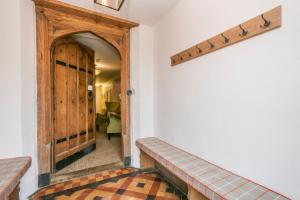 a hallway with a wooden door and a entry way at Heacham Manor Hotel in Hunstanton
