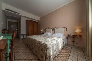 Letto o letti in una camera di Albergo La Primula
