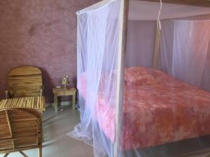 Ένα ή περισσότερα κρεβάτια σε δωμάτιο στο Terra Lodge Sénégal +89 φωτογραφίες