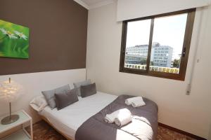 Posteľ alebo postele v izbe v ubytovaní DIFFERENTFLATS Casalmar