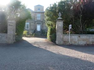 an entrance to a house with a stone gate at Kirkmay House in Crail