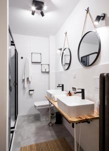 a bathroom with a sink and a mirror at Local 21A in Zakopane