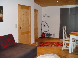 a living room with a couch and a table at Haus Weichart in Sulzburg