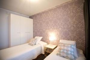 Postel nebo postele na pokoji v ubytování Majesteetti Apartments