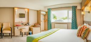 Letto o letti in una camera di Gleneagle Killarney