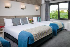 Letto o letti in una camera di Gleneagle Killarney