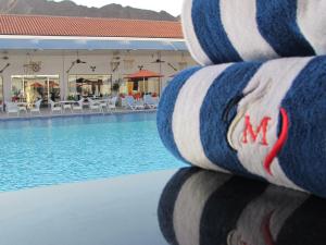 a close up of a swimming pool with a volley ball at Mirage Bab Al Bahr Beach Resort in Dibba