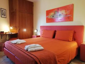 Postel nebo postele na pokoji v ubytování B&B Domus Traiani Benevento