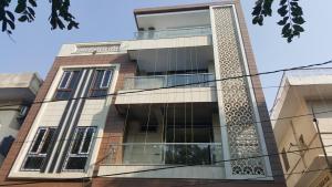 a tall building with a lot of windows at Neetu's Home Stay in Jaipur