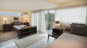 A bed or beds in a room at Athens Lycabettus Hill Penthouse, Private Roof Garden & Pool