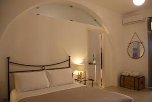 Ένα ή περισσότερα κρεβάτια σε δωμάτιο στο Santo Mercurio Country House