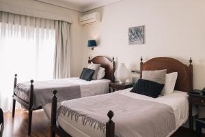 Кровать или кровати в номере Hotel Sao Jose