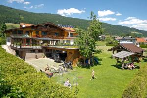 a house with a playground in front of it at Wellnesshaus Reichelt in Radstadt