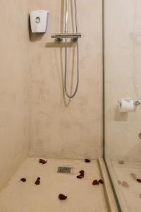 a bathroom with a shower stall and a toilet at Hotel Sao Jose in Porto
