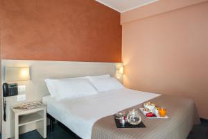 Postel nebo postele na pokoji v ubytování Hotel Testani Colleferro