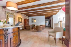 a large living room with a table and chairs at Hotel Vorderburg in Schlitz