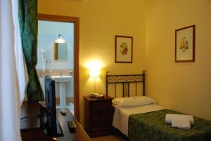 Postel nebo postele na pokoji v ubytování Hotel del Centro