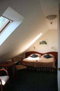 מיטה או מיטות בחדר ב-Hotel Saol