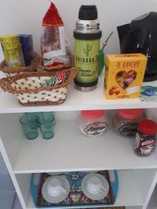 a shelf of a refrigerator filled with food and drinks at Apartamento Uriburu-Con Cochera in Formosa