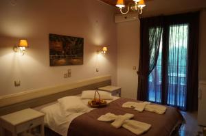 A bed or beds in a room at Nontas Home