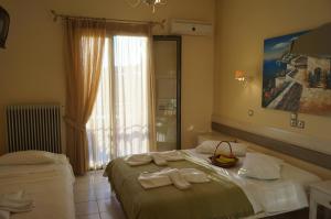 A bed or beds in a room at Nontas Home