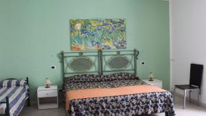 Ένα ή περισσότερα κρεβάτια σε δωμάτιο στο Casa Vacanza Alba 8-10 posti letto