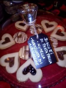 a plate of cookies with a sign on top of it at B&B La Porticella in Viterbo